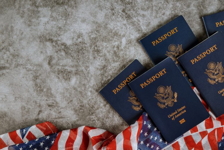 American passports and flag with the symbols of the United States of America.