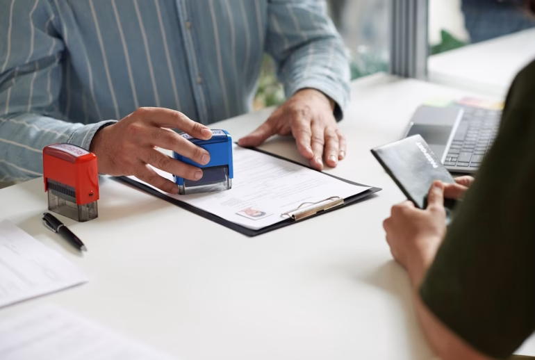 Close-up of manager giving visa to client, he putting stamp on documents while sitting at table with woman SSUCv3H4sIAAAAAAAACpxUyW7bMBC9F+g/GDyXAHeK/ZWiB5KiYiKy6EpUCiPIv3e0mnKSFijgg/lmfTPz9Pr1y+mEnB2iR99Pr9ML3rFtxyH3NsfUAUy+rXgfujr0JfLSc0VKwMbyFeqYUx9tW4LOZn/u7CUA2I1tO8FvsxEN2eZxCEPRy3Aecw79kJN/BphvWepwTUPM13PKaTgY+mAvQ45z/h29pq6WJWBbe7kBQDeAMt43B486ufCubtOHcI0TRIvGvc3hCZgeWt/G+mN5nzbDbIQIMCG05l24jm7GNmhJ/l+Ry5+fO5en0PmJ7utb0XUf2mCXca89Ika9kFUwuKHSY6F0g02oPVZCNVbzipFgtsrIM8aDazyWimksuDO4YlWFvXKCCGeMknZ3bhRz1AWHuYAIoWWNK9cEbA1zhPiaCkJ3Zyc18doGHCAEC6oYNsZYHKyEoDoo5+VMdmGInn/DjVzm4a/c7FjHVCzjJXnbzodSDMDGq+3tIe7aRx+7pwJJ+Twf/ZbJp7HL/a3cAWpTulrXTifXQJmw4Wc7DOBeb3h5MiCxdCnqdCnPq1izohpuanpSzoWiWnLFYaBUcI5KtZwj5Jnb2Rocr22ydZiK7nfzqCOqCVUV0VruZ/ROUosPpXLTyKO6dodNHYXQdpu+23bNrTZd2Db5rTZTFY0dlLg4sEqzu0MhSrDCD254MW4SmhRyiTCB41Q+yCy5/LQt2AH76yykEEXfH85caiM+G5cywvxrH5oZs3I7fDmhRqzLz8+BG4LAymhY+H6zGzX0a4z+ub01N8YpI4RUZPc5UERQmRsK34Dd/sAQMThRAaXEXcobQ8SkFgQysHv2B4JIGUqUkpLM2l6pxWllyNBArFUcUyUIFl4rbAjRmDBiiDDWMaYg6u0PAAAA//8DAK3ixOnSBgAA
